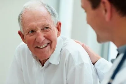 An older man consulting with a doctor about sleep apnea treatment in Loveland.